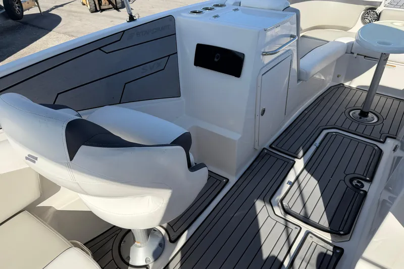 Slide: The Image of 2023 Starcraft SVX 231 OB boat interior with seating and deck details. - 11