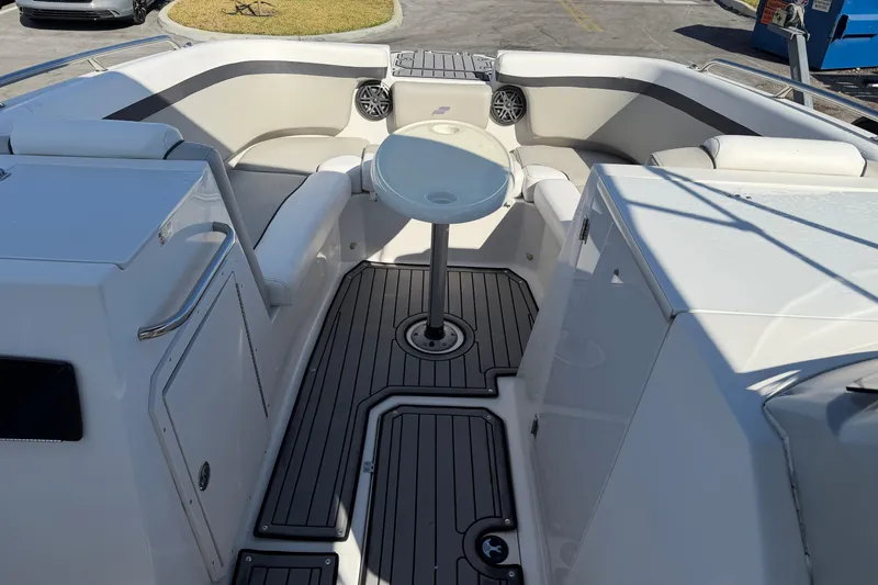 Slide: The Image of 2023 Starcraft SVX 231 OB boat interior with seating and table. - 12