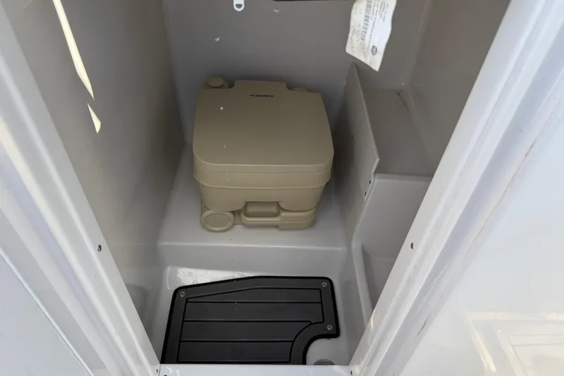 Slide: The Image of 2023 Starcraft SVX 231 OB boat interior with portable toilet. - 15