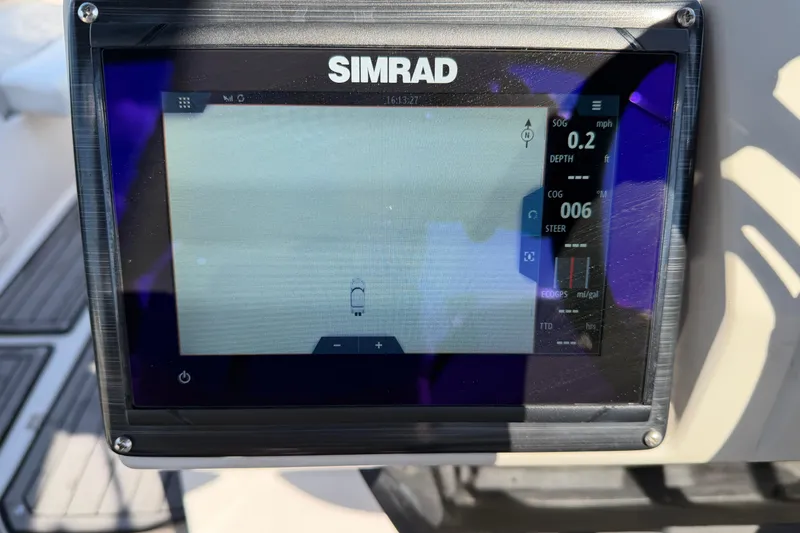 Slide: The Image of Simrad navigation display on 2023 Starcraft SVX 231 OB boat dashboard. - 19