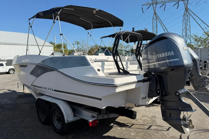 Slide: The Image of 2023 Starcraft SVX 231 OB boat with Yamaha engine on trailer. - 5