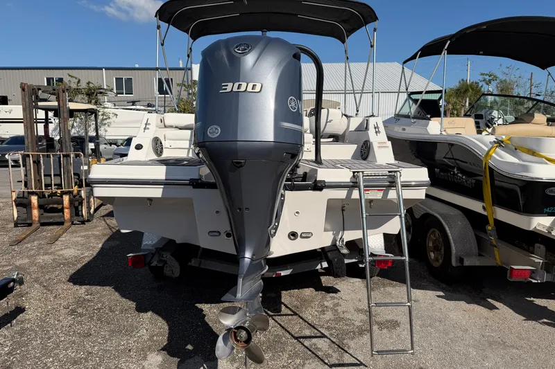 Slide: The Image of 2023 Starcraft SVX 231 OB boat with Yamaha 300 engine, parked outdoors. - 6