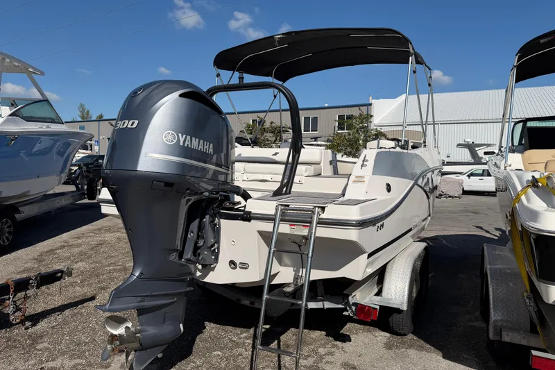 Slide: The Image of 2023 Starcraft SVX 231 OB boat with Yamaha 300 engine, parked outdoors. - 7