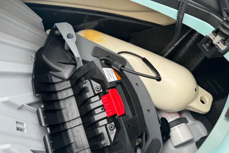 Slide: The Image of Storage compartment of 2024 Sea Doo Wake 170 with safety equipment and accessories. - 11