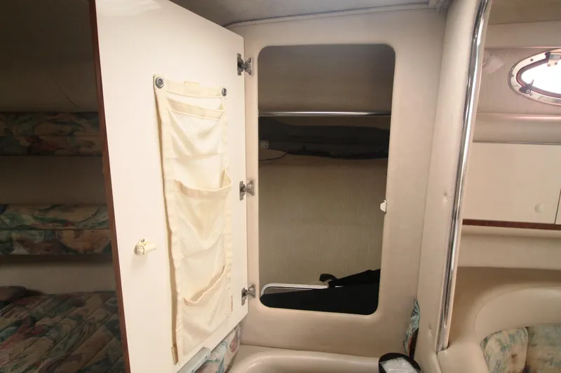 Slide: The Image of Interior cabin of 1996 Sea Ray Sundancer 330 with open storage compartment. - 11
