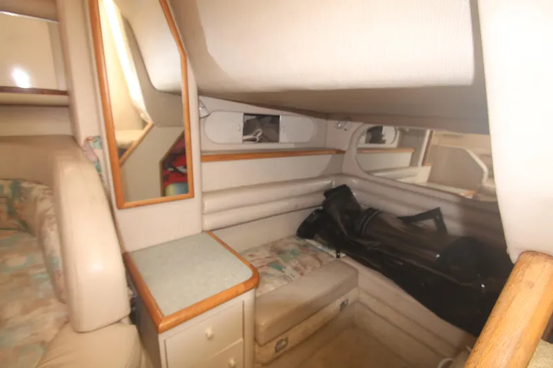 Slide: The Image of Interior cabin of 1996 Sea Ray Sundancer 330 with seating and storage. - 12