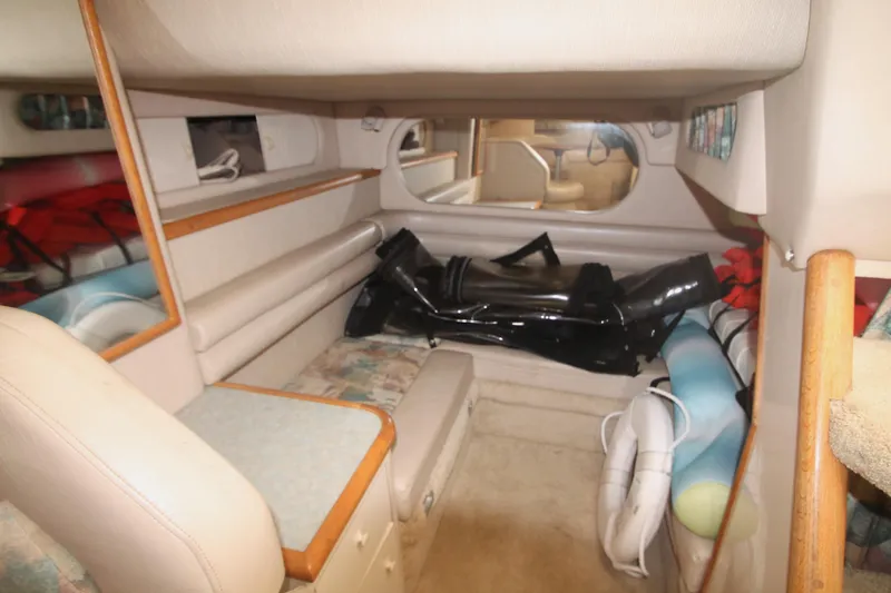 Slide: The Image of Interior cabin of 1996 Sea Ray Sundancer 330 with seating and storage. - 13