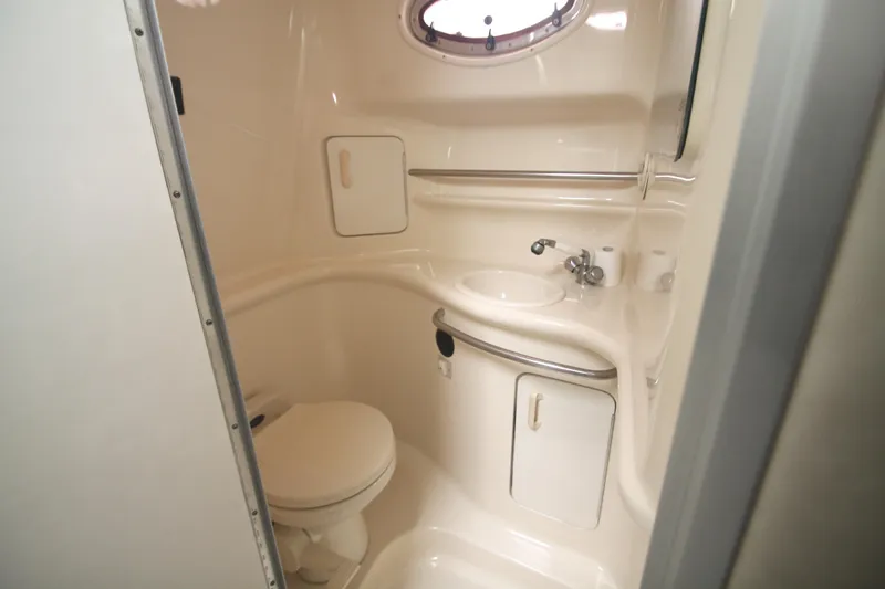 Slide: The Image of Bathroom interior of 1996 Sea Ray Sundancer 330 yacht, featuring sink and toilet. - 22