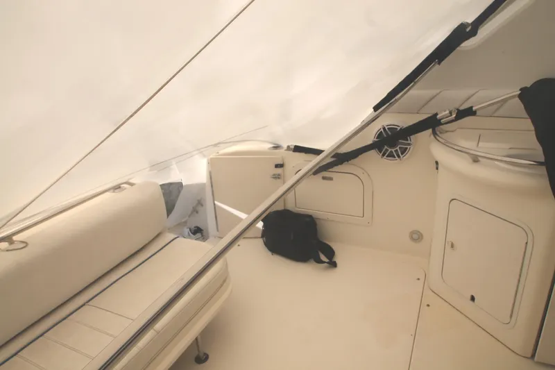Slide: The Image of 1996 Sea Ray Sundancer 330 interior with seating and storage compartments. - 29