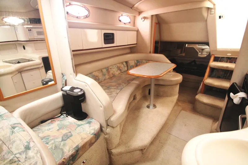 Slide: The Image of Interior of 1996 Sea Ray Sundancer 330 yacht with cozy seating and kitchenette. - 3
