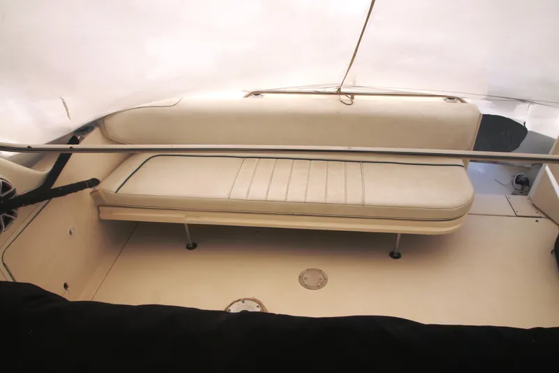 Slide: The Image of 1996 Sea Ray Sundancer 330 interior with white seating and sleek design. - 30