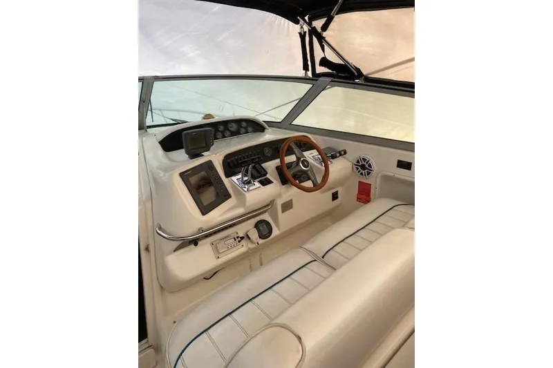 Slide: The Image of 1996 Sea Ray Sundancer 330 helm with steering wheel and control panel. - 37