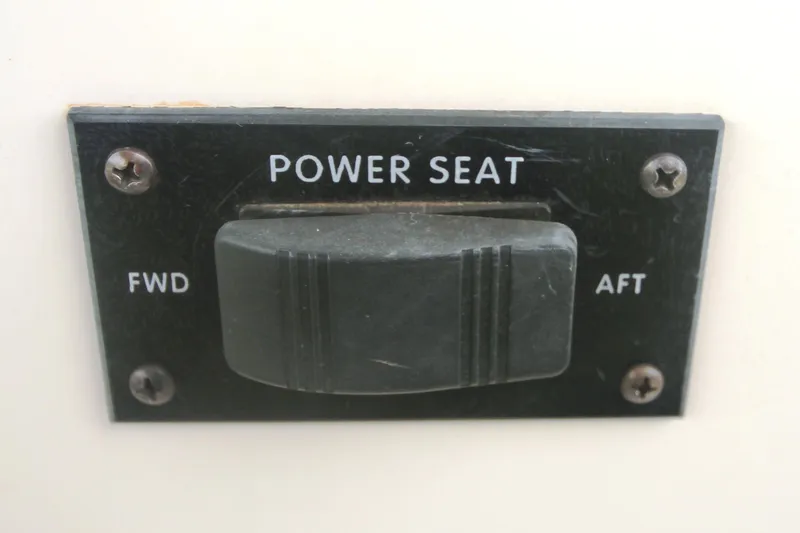 Slide: The Image of Power seat control switch on 1996 Sea Ray Sundancer 330 boat dashboard. - 46