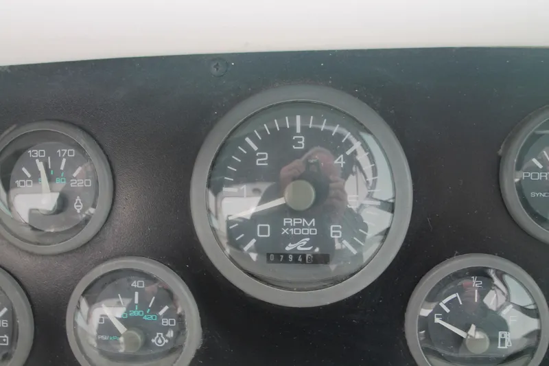 Slide: The Image of Dashboard gauges of a 1996 Sea Ray Sundancer 330 boat. - 47