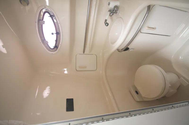 Slide: The Image of Bathroom interior of 1996 Sea Ray Sundancer 330 yacht, featuring toilet and sink. - 60