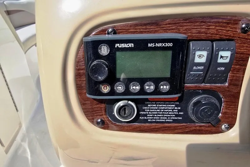 Slide: The Image of Control panel of a 2005 Chaparral Sunesta 254 boat with Fusion MS-NRX300. - 18