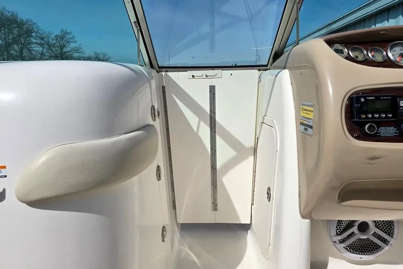 Slide: The Image of 2005 Chaparral Sunesta 254 boat interior with dashboard and seating area. - 23