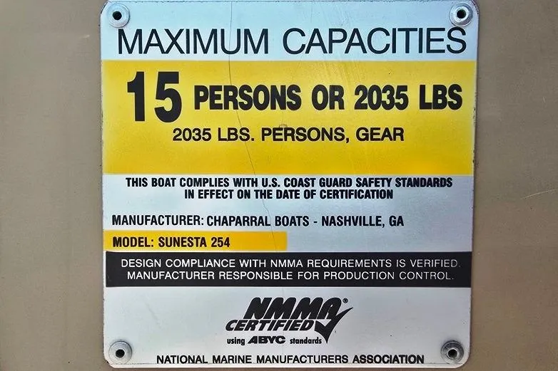 Slide: The Image of 2005 Chaparral Sunesta 254 capacity plate: 15 persons or 2035 lbs, NMMA certified. - 24