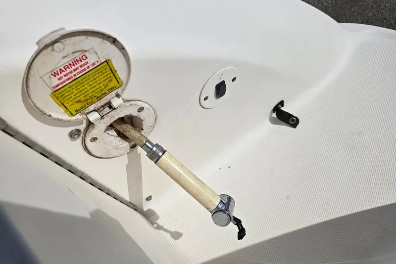 Slide: The Image of Fuel cap and hose on 2005 Chaparral Sunesta 254 boat deck. - 25