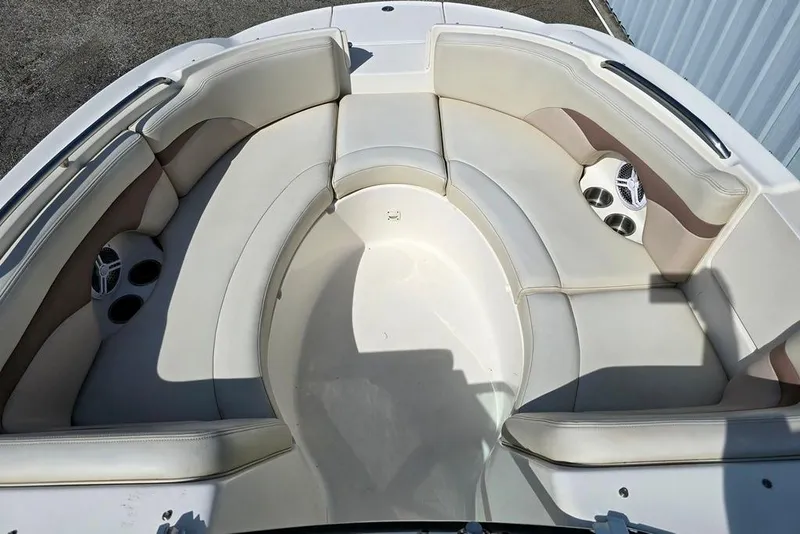 Slide: The Image of 2005 Chaparral Sunesta 254 boat interior with spacious seating and cup holders. - 3
