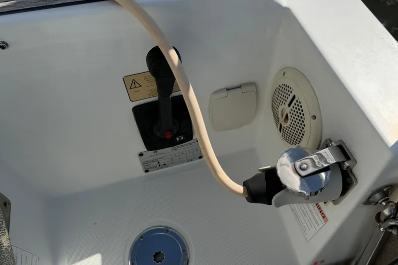 Slide: The Image of Cockpit controls of a 2015 Jeanneau Sun Odyssey 349 sailboat, featuring throttle and speaker. - 10