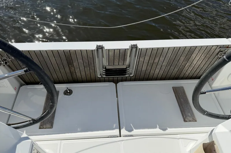 Slide: The Image of Cockpit of 2015 Jeanneau Sun Odyssey 349 sailboat with dual steering wheels. - 12