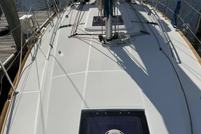 Slide: The Image of 2015 Jeanneau Sun Odyssey 349 sailboat deck with rigging and dockside view. - 15