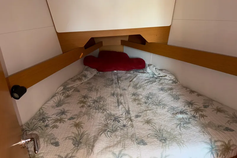 Slide: The Image of Cozy cabin interior of 2015 Jeanneau Sun Odyssey 349 sailboat with tropical bedding. - 21