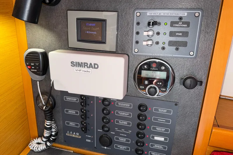 Slide: The Image of Control panel of a 2015 Jeanneau Sun Odyssey 349 sailboat with Simrad VHF radio. - 24