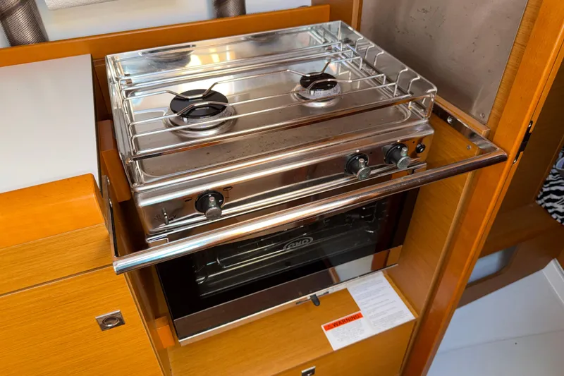 Slide: The Image of Stainless steel stove and oven in 2015 Jeanneau Sun Odyssey 349 yacht galley. - 27