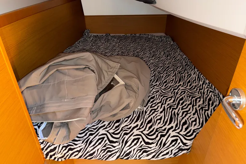 Slide: The Image of Cabin interior of 2015 Jeanneau Sun Odyssey 349 with zebra-patterned bedding. - 29