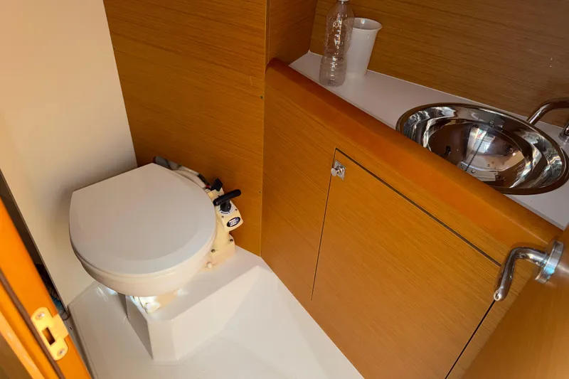Slide: The Image of Bathroom interior of 2015 Jeanneau Sun Odyssey 349 yacht with toilet and sink. - 32