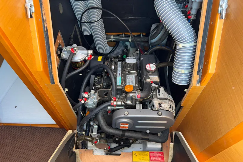 Slide: The Image of Engine compartment of a 2015 Jeanneau Sun Odyssey 349 sailboat, showcasing detailed components. - 33