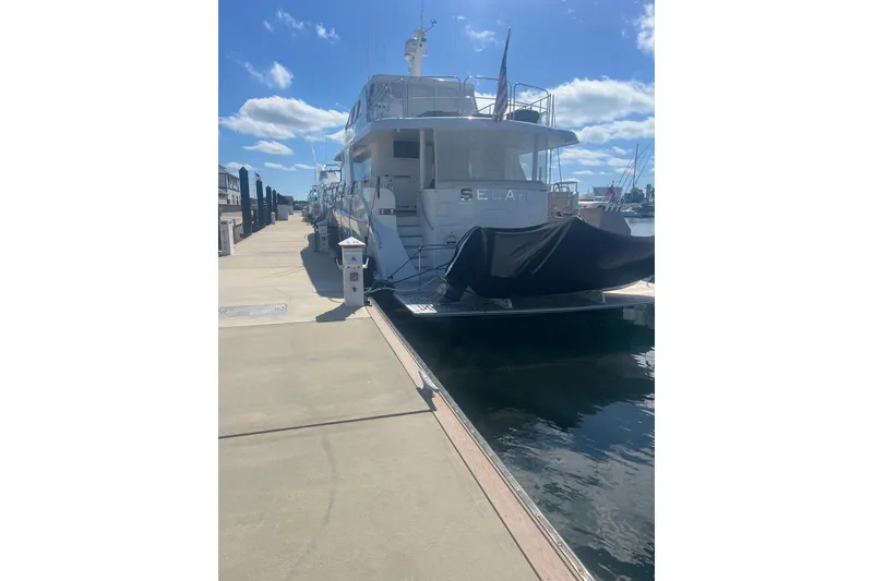 Slide: The Image of 2018 Cheoy Lee Bravo 78 Sport Motor Yacht docked at marina under blue sky. - 4
