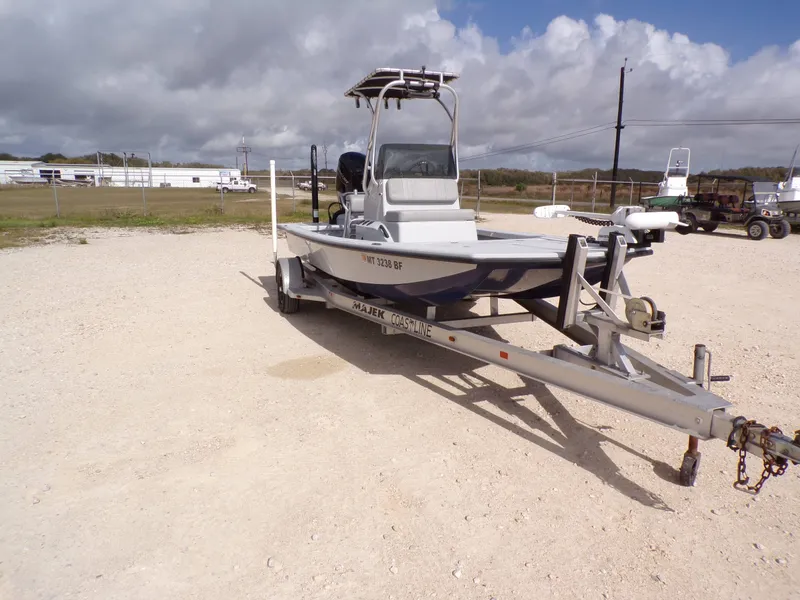 Slide: The Image of 2022 Majek 18 Illusion M2 boat on trailer outdoors. - 15