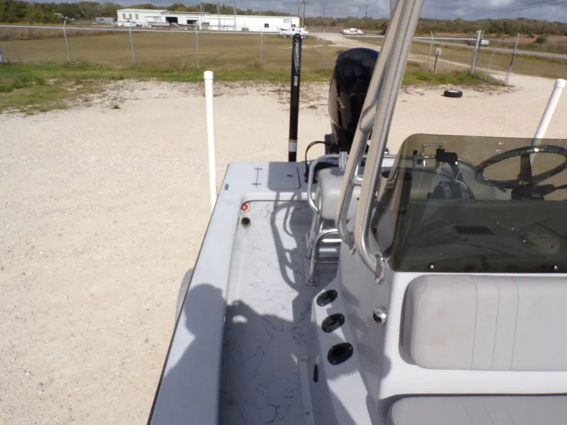 Slide: The Image of Majek 18 Illusion M2 boat, 2022 model, parked on gravel lot. - 20