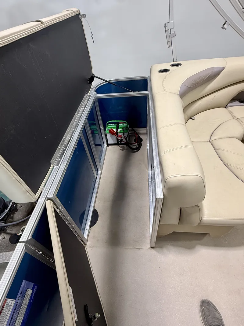 Slide: The Image of Interior of a 2017 Sylvan 8520 boat with seating area. - 22