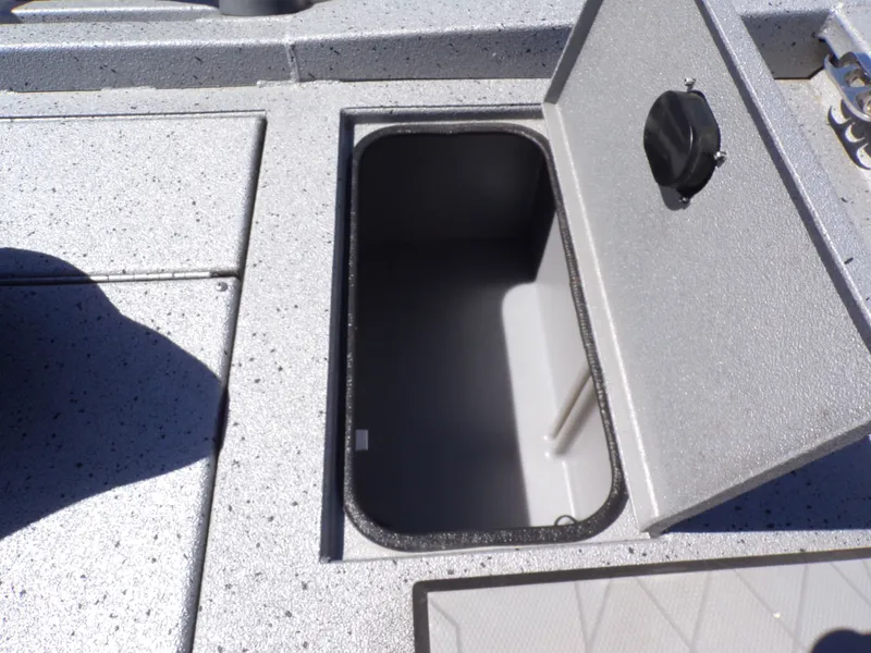 Slide: The Image of Open storage compartment on a 2021 Xpress H190B Bay boat. - 24