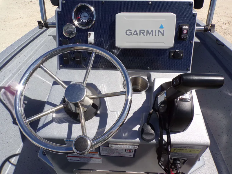 Slide: The Image of Steering console of a 2021 Xpress H190B Bay boat with Garmin system. - 6