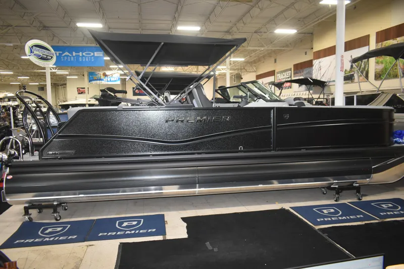 The Image of 2026 Premier 250 Solaris Sport pontoon boat displayed in showroom. - 0