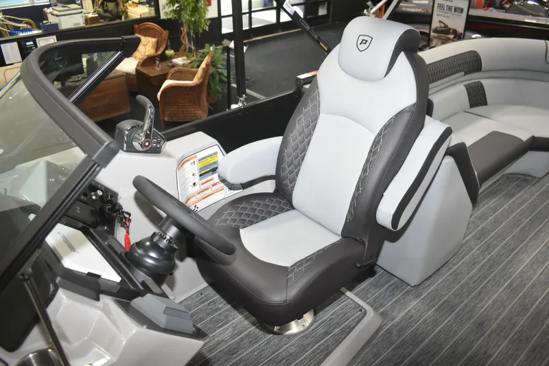 Slide: The Image of 2026 Premier 250 Solaris Sport boat interior with luxurious seating and modern controls. - 14