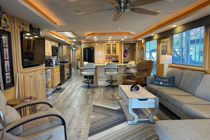 Slide: The Image of Luxurious 2005 Starlite 16x82 houseboat interior with modern kitchen and cozy living area. - 3