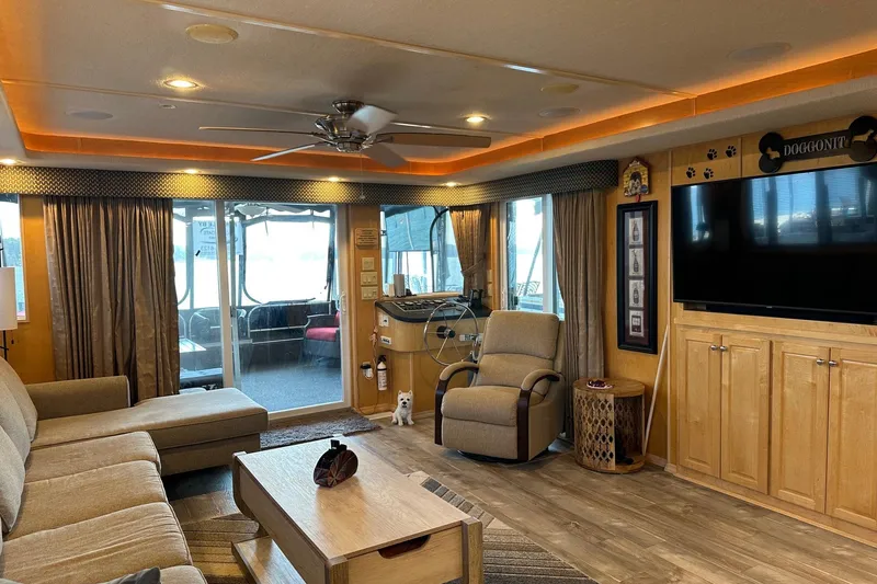 Slide: The Image of Cozy 2005 Starlite 16x82 houseboat interior with modern furnishings and large windows. - 4
