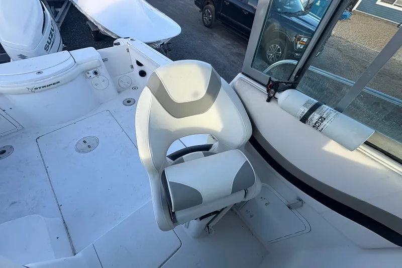 Slide: The Image of 2002 Seaswirl Striper 2301 Walkaround O/B boat interior with seating and equipment. - 14