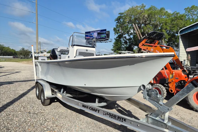 Slide: The Image of 2026 May-Craft 208 CC boat on trailer, outdoor dealership setting. - 1