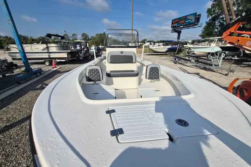 Slide: The Image of 2026 May-Craft 208 CC boat displayed in a marina with other vessels. - 4