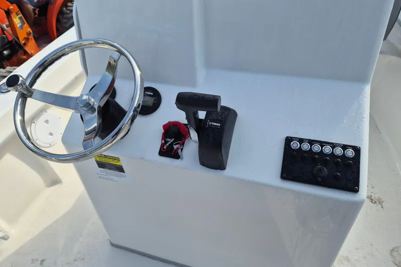 Slide: The Image of 2026 May-Craft 208 CC boat console with steering wheel and controls. - 6