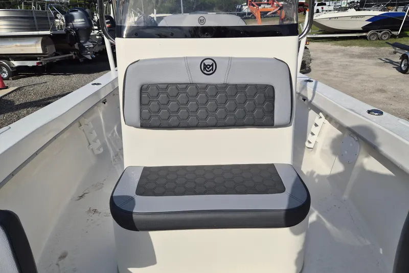 Slide: The Image of 2026 May-Craft 208 CC boat interior with cushioned seating and hexagonal pattern design. - 7