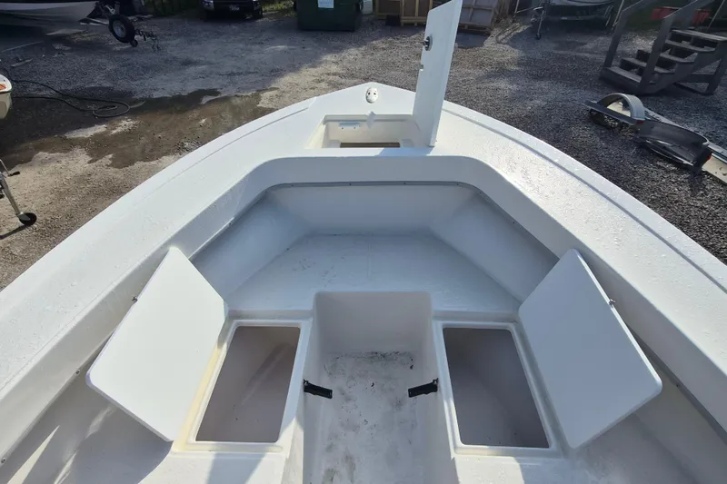 Slide: The Image of 2026 May-Craft 208 CC boat interior with open storage compartments. - 8