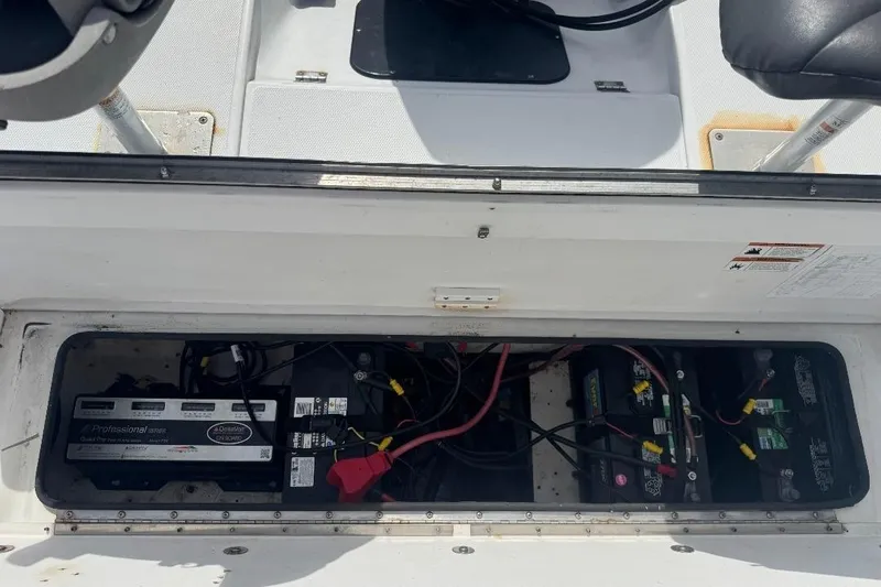 Slide: The Image of Battery compartment of a 2003 Ranger 2180 Bay Ranger boat with wiring and components. - 3